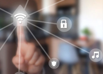Dedo fixo em um ícone de casa conectada, ligando a outros ícones de segurança e IoT